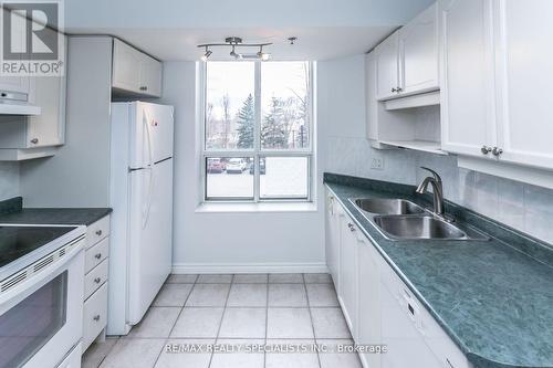 209 - 4640 Kimbermount Avenue, Mississauga, ON - Indoor Photo Showing Kitchen With Double Sink