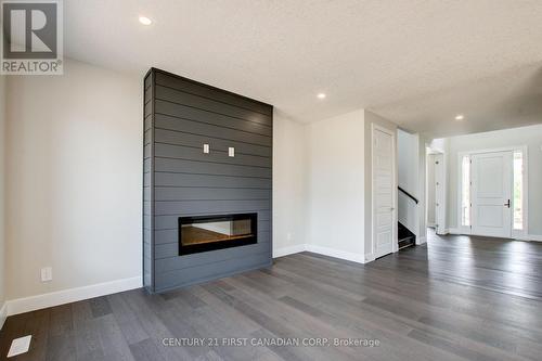 100 Aspen Circle, Thames Centre (Thorndale), ON - Indoor Photo Showing Living Room With Fireplace