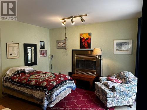 984 Partington, Windsor, ON - Indoor Photo Showing Bedroom With Fireplace