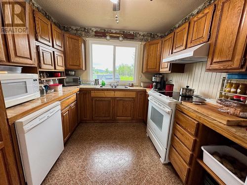 713 49 Highway, Dawson Creek, BC - Indoor Photo Showing Kitchen With Double Sink