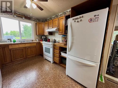 713 49 Highway, Dawson Creek, BC - Indoor Photo Showing Kitchen With Double Sink