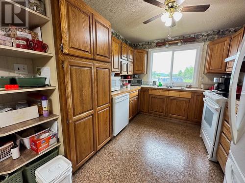 713 49 Highway, Dawson Creek, BC - Indoor Photo Showing Kitchen With Double Sink