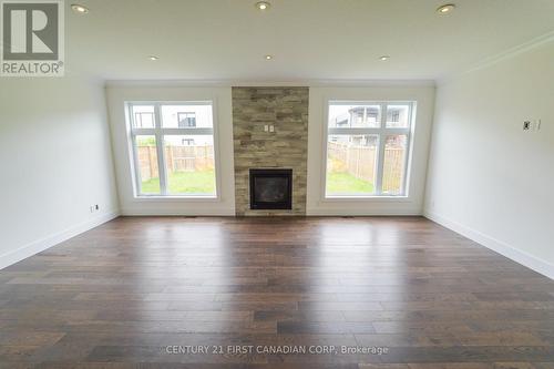 6956 Raleigh Boulevard, London, ON - Indoor Photo Showing Living Room With Fireplace