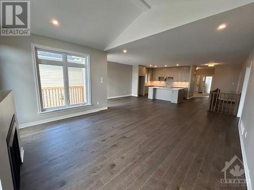hardwood and ceramic tile throughout main floor, vaulted ceiling in living room, extra potlights, gas fireplace - 755 Keinouche Place, Ottawa, ON - Indoor