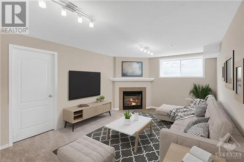 Basement Virtually Staged - 108 Eye Bright Crescent, Ottawa, ON - Indoor Photo Showing Other Room With Fireplace