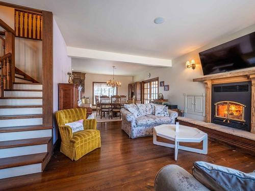 Living room - 30  - 32 Ch. Des Peupliers, Mont-Tremblant, QC - Indoor Photo Showing Living Room With Fireplace