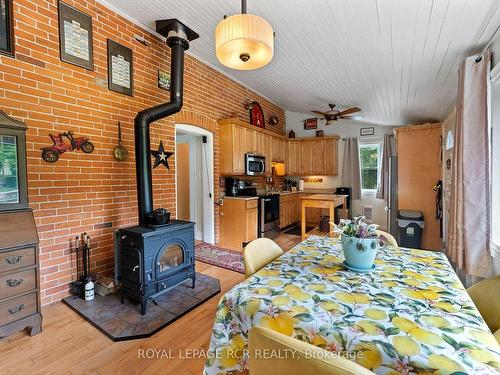 22021 E Gara-Erin Tline, East Garafraxa, ON - Indoor Photo Showing Dining Room With Fireplace