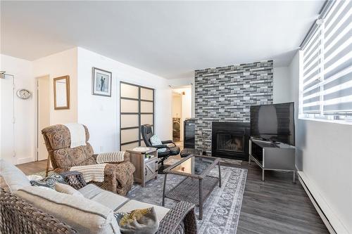 700 Dynes Road|Unit #1106, Burlington, ON - Indoor Photo Showing Living Room With Fireplace