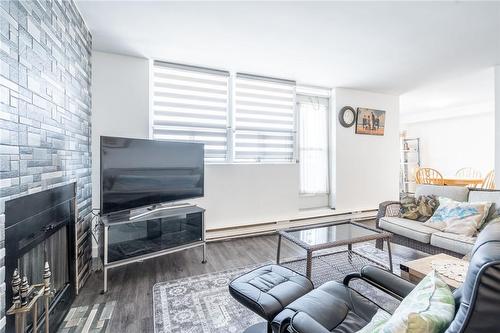 700 Dynes Road|Unit #1106, Burlington, ON - Indoor Photo Showing Living Room With Fireplace