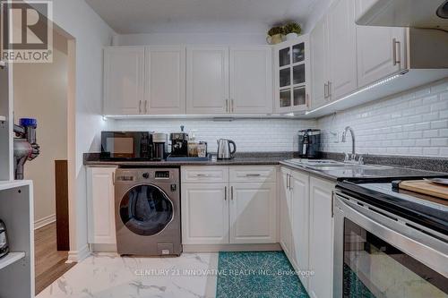 406 - 4101 Sheppard Avenue E, Toronto E07, ON - Indoor Photo Showing Laundry Room