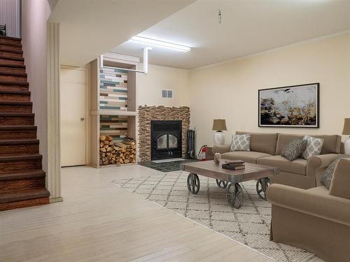 39092 34N Road, La Broquerie, MB - Indoor Photo Showing Living Room With Fireplace