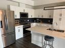 309 3400 Mcdonald Avenue, Brandon, MB  - Indoor Photo Showing Kitchen With Double Sink 