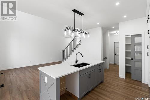 705 Sarazen Drive, Warman, SK - Indoor Photo Showing Kitchen With Double Sink