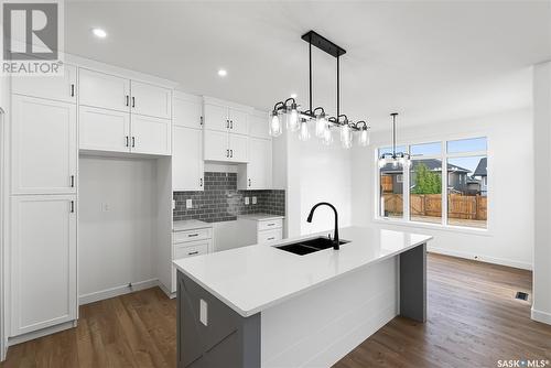 705 Sarazen Drive, Warman, SK - Indoor Photo Showing Kitchen With Double Sink With Upgraded Kitchen