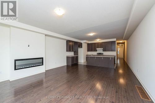 65 Donald Ficht Crescent, Brampton, ON - Indoor With Fireplace
