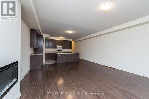 65 Donald Ficht Crescent, Brampton, ON - Indoor Photo Showing Kitchen With Fireplace