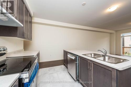 65 Donald Ficht Crescent, Brampton, ON - Indoor Photo Showing Kitchen With Double Sink