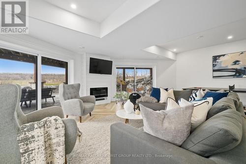 1640 Joe Oliver Road, Hamilton Township, ON - Indoor Photo Showing Living Room With Fireplace