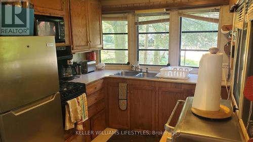 425 - 76735 Wildwood Line, Bluewater (Bayfield), ON - Indoor Photo Showing Kitchen With Double Sink