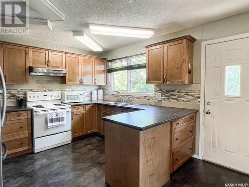 508 Cochin Avenue, Meadow Lake, SK - Indoor Photo Showing Kitchen With Double Sink