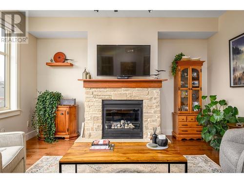 333 Longspoon Drive Unit# 34, Vernon, BC - Indoor Photo Showing Living Room With Fireplace