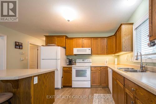 30 Aletha Drive, Prince Edward County (Wellington), ON - Indoor Photo Showing Kitchen With Double Sink