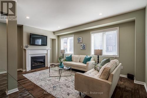 67 - 470 Beach Boulevard, Hamilton, ON - Indoor Photo Showing Living Room With Fireplace