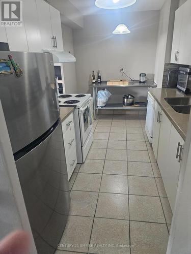 503 - 2825 Islington Avenue, Toronto, ON - Indoor Photo Showing Kitchen With Double Sink