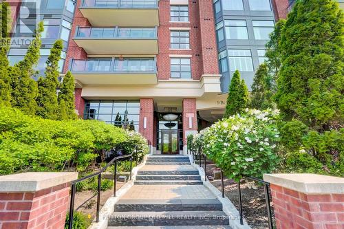 101 - 9 Burnhamthorpe Crescent, Toronto, ON - Outdoor With Balcony With Facade