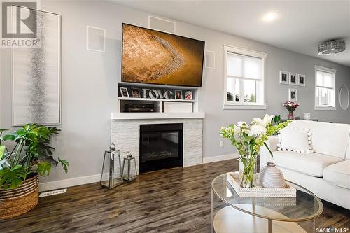 200 Willow Ridge Drive, Pilot Butte, SK - Indoor Photo Showing Living Room With Fireplace