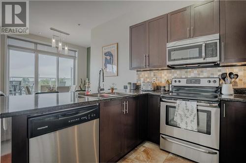 703 Cotton Mill Street Unit#305, Cornwall, ON - Indoor Photo Showing Kitchen With Double Sink