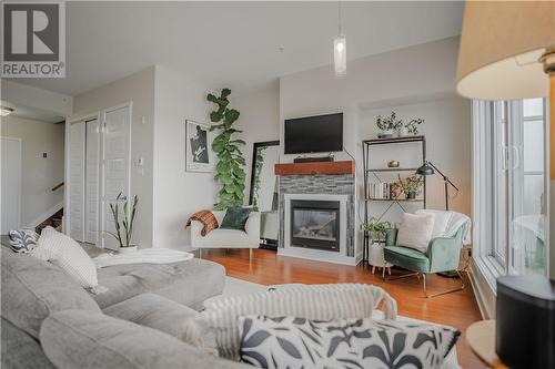 703 Cotton Mill Street Unit#305, Cornwall, ON - Indoor Photo Showing Living Room With Fireplace