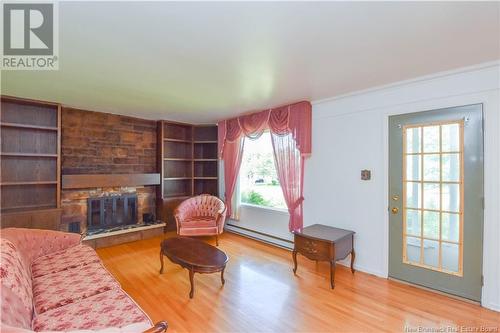 8150 Saint-Paul Street, Bas-Caraquet, NB - Indoor Photo Showing Living Room With Fireplace