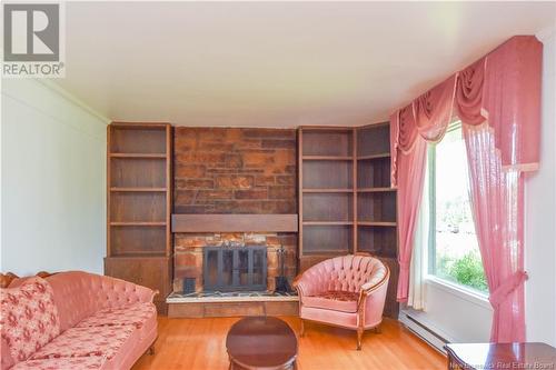 8150 Saint-Paul Street, Bas-Caraquet, NB - Indoor Photo Showing Living Room With Fireplace