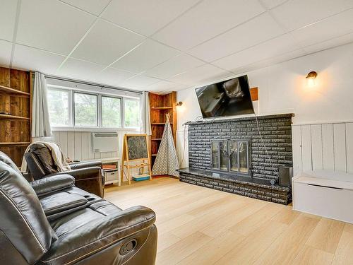 Family room - 13 Rue Mady, Lachute, QC - Indoor Photo Showing Living Room With Fireplace