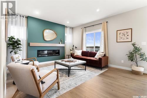 8641 Wheat Crescent, Regina, SK - Indoor Photo Showing Living Room With Fireplace