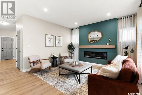 8641 Wheat Crescent, Regina, SK - Indoor Photo Showing Living Room With Fireplace