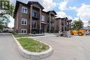 233 Watson Unit# 106, Windsor, ON  - Outdoor With Balcony With Facade 