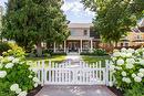 1001 Lawrence Avenue, Kelowna, BC  - Outdoor With Deck Patio Veranda With Facade 