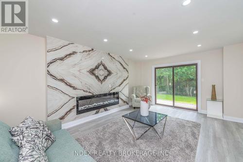 12 Dawnridge Trail, Brampton, ON - Indoor Photo Showing Living Room With Fireplace