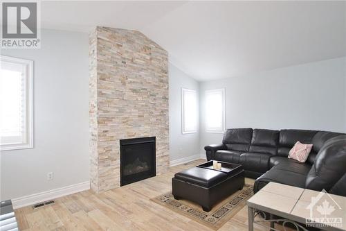 6528 Tooney Drive, Ottawa, ON - Indoor Photo Showing Living Room With Fireplace