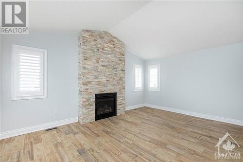 6528 Tooney Drive, Ottawa, ON - Indoor Photo Showing Living Room With Fireplace