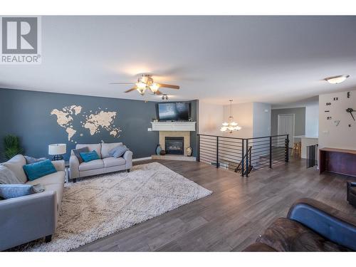 127 Stocks Crescent, Penticton, BC - Indoor Photo Showing Living Room With Fireplace