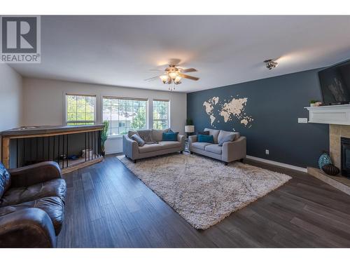 127 Stocks Crescent, Penticton, BC - Indoor Photo Showing Living Room With Fireplace