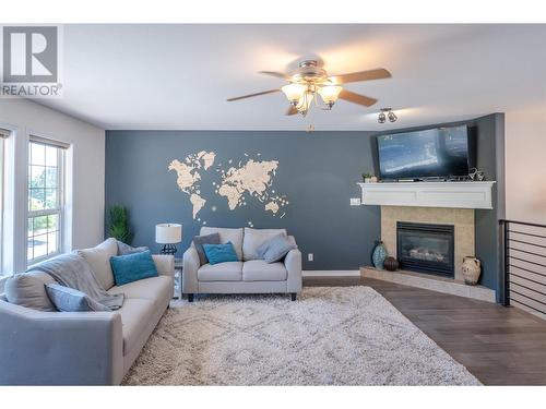 127 Stocks Crescent, Penticton, BC - Indoor Photo Showing Living Room With Fireplace