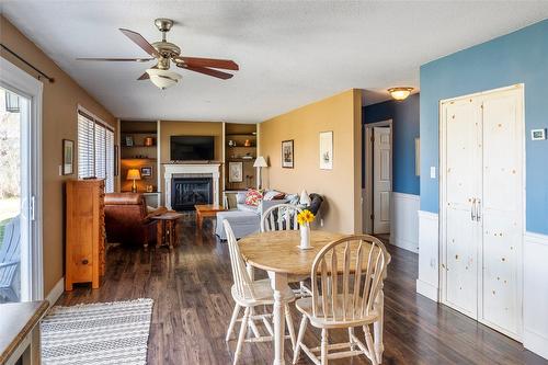 10692 Teresa Road, Lake Country, BC - Indoor Photo Showing Dining Room With Fireplace