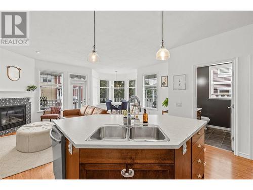 380 Providence Avenue Unit# 9, Kelowna, BC - Indoor Photo Showing Kitchen With Fireplace With Double Sink