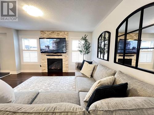 18 Tawnberry Circle, Brampton, ON - Indoor Photo Showing Living Room With Fireplace