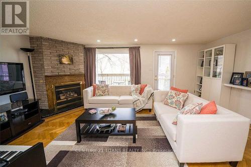 41 - 1051 Cedarglen Gate, Mississauga, ON - Indoor Photo Showing Living Room With Fireplace