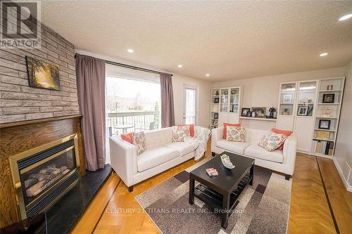 41 - 1051 Cedarglen Gate, Mississauga, ON - Indoor Photo Showing Living Room With Fireplace